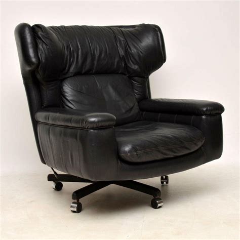 Faux leather reclining armchair with charging function. 1960s Vintage Leather Reclining Armchair and Stool For ...