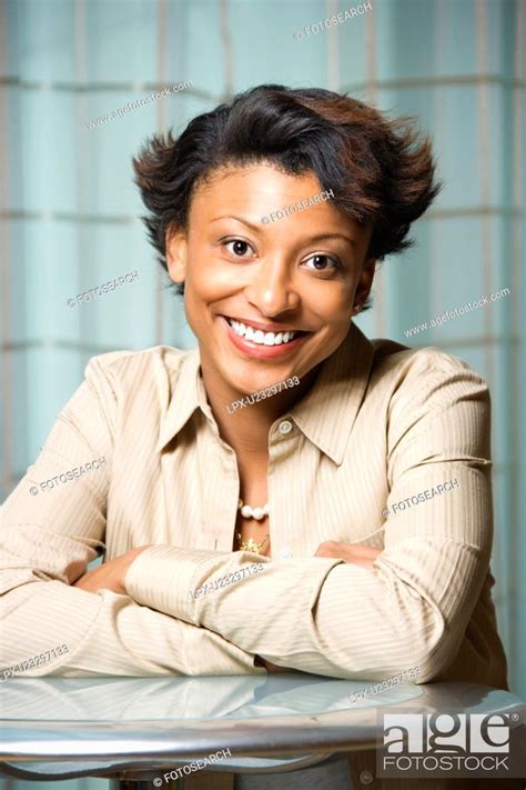 Portrait Of Smiling African American Woman Stock Photo Picture And
