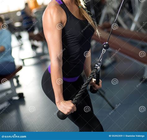 Woman Exercising Her Arms And Back At The Gym On A Stock Image Image Of Healthy Athletic