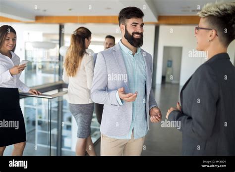 Picture Of Business Colleagues Talking In Office Stock Photo Alamy