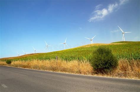 Windmills Wind Turbines Farm Power Generators Against Landscape Against