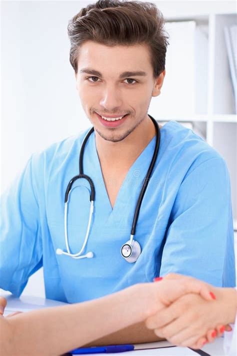 Attractive Male Surgeon Doctor At Medical Meeting Or Patient