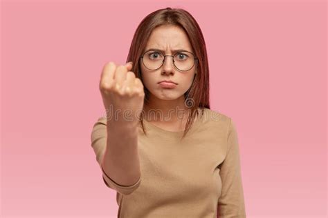 Angry Beautiful Young Woman Shows Fist At Camera Threats Someone