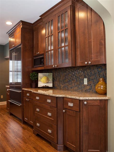 Doors keep pets, such as cats, out so you can avoid things falling out. Transitional Kitchen Cabinets With Mosiac Tile Backsplash ...
