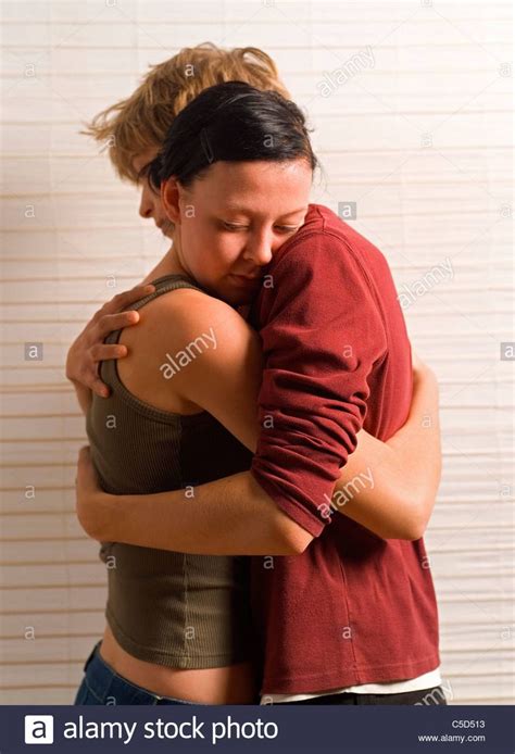 Side View Of A Young Couple Hugging Each Other Stock Photo Royalty