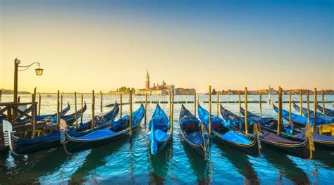 Venice Lagoon San Giorgio Church Gondolas And Poles Italy Stock