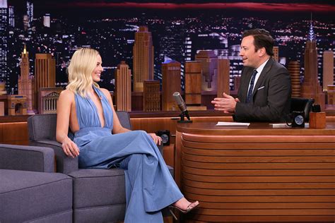 margot robbie s plunging jumpsuit and strappy sandals outfit footwear news