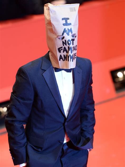 Shia Labeouf Wearing That I Am Not Famous Anymore Bag On His Head On