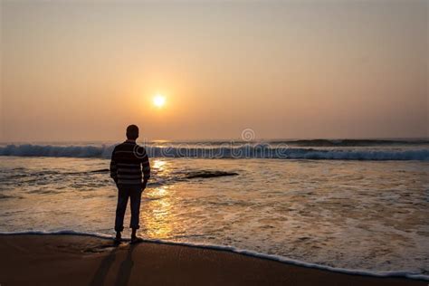 A Man Watching Sunrise In Sea Beach From Digha Popular Spot Of