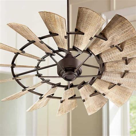 This windmill, oiled bronze design is a lot of fun! 15 Unique Ceilings Fans That Are Both Functional & Stylish