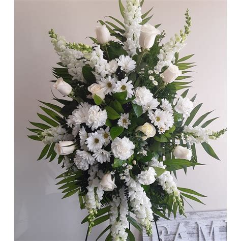 From dainty pretty posies to majestic grand arrangements our range of flowers aims to have something for everyone. Classic all white standing spray Mel's Blossoms: Portage ...