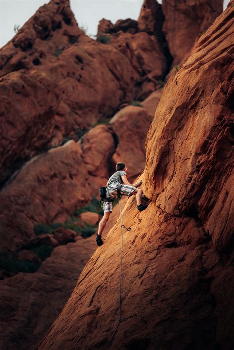 Man Rock Climbing On Mountain Side · Free Stock Photo
