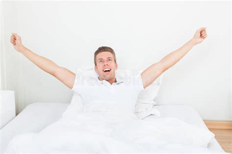 Man Waking Up In Morning And Stretching On Bed Stock Photo Image Of