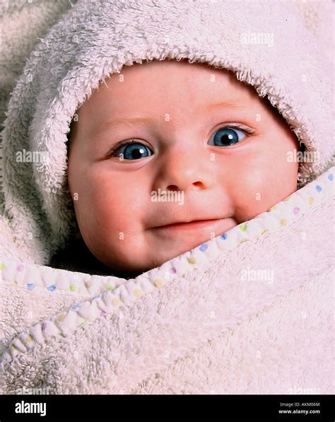 Baby In Towel Stock Photo Alamy