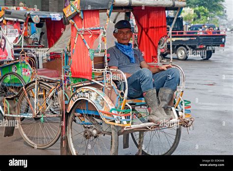 Indonesian Becak Driver Waiting For Clients In His Cycle Rickshaw Kota