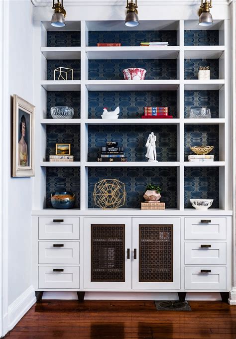 Custom Bookcase With Blue And Gold Accent Wallpaper By Michele Plachter