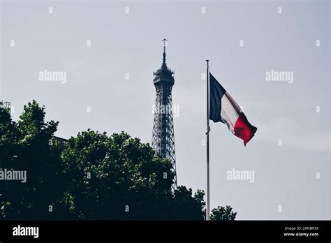 Eiffel Tower With The French Flag In The Front Stock Photo Alamy