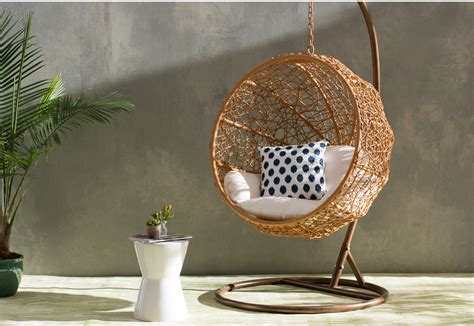 It's crafted from slender rods of metal, as opposed to the. Sky Valley Round Swing Chair with Stand - Hanging Chairs