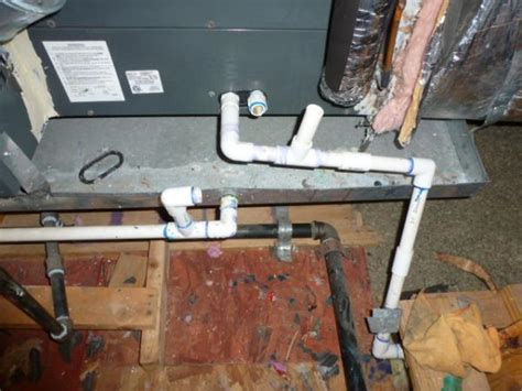 These central air conditioning units can rely on an outdoor condensing unit to supply subzero cool temperatures through indoor vents. Two PVC pipes leaving furnace/AC unit connected correctly ...