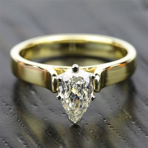 The glistening sheen of a yellow gold diamond engagement ring makes for a classic and sophisticated look. Contour Solitaire Engagement Ring in Yellow Gold