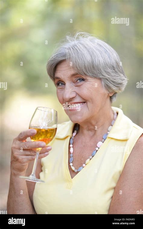 Old Woman Drinking Wine Stock Photo Alamy