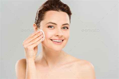 Positive And Naked Woman Holding Cotton Pad Near Face Isolated On Grey Stock Photo By