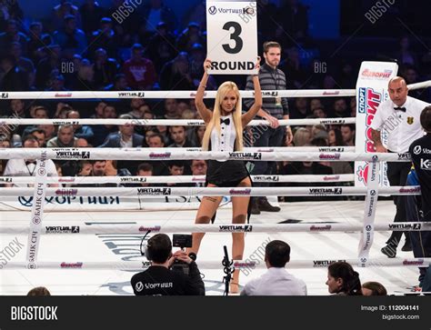 Boxing Ring Girls Holding A Board With Round Number Stock