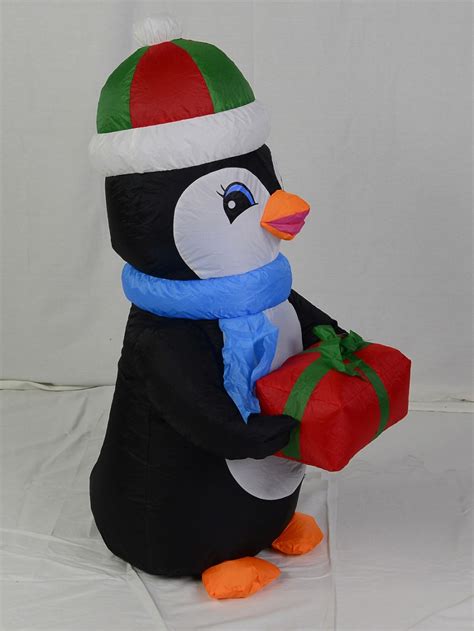 All our inflatable christmas decorations are. Penguin With Gift - Standing Inflatable & Illuminated 1.3m ...