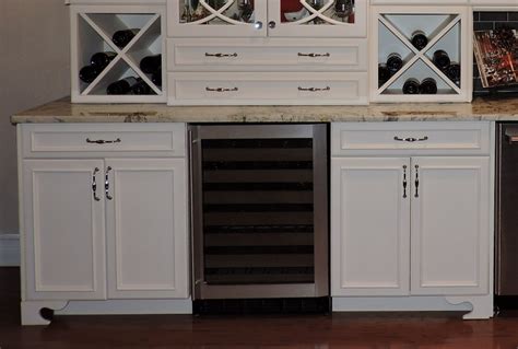 Include wine racks, shelves, and drawers, all hidden in a hardwood frame. South Tampa Kitchen Remodel by Gulf Tile & Cabinetry