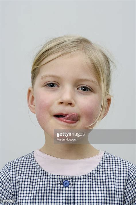 A Young Girl Licking Her Lips Photo Getty Images