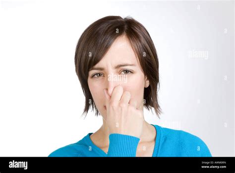 Holding Her Nose Hi Res Stock Photography And Images Alamy