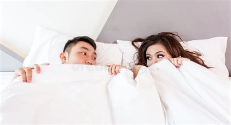 Couple Hiding Under Sheets In Bed Picture Image 86228588