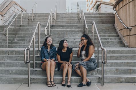 Three Women Smiling While Sitting On Stairs Pixeor Large Collection