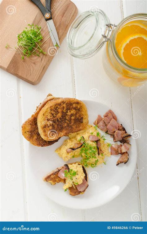 Scrambled Eggs With French Toast Topped With Watercress Scrambled Eggs