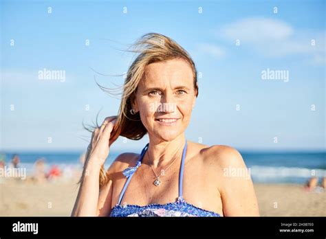 Portrait Of A Beautiful Smiling Middle Aged Woman On The Beach The Sky
