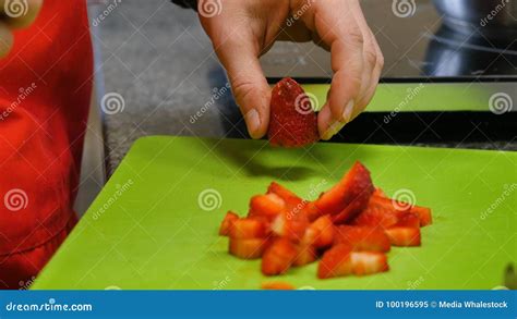 Chef Hand And Knife Slicing Fresh Strawberry On Cutting Board Stock