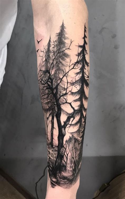 A Mans Arm With Trees And Birds In The Sky On His Left Leg