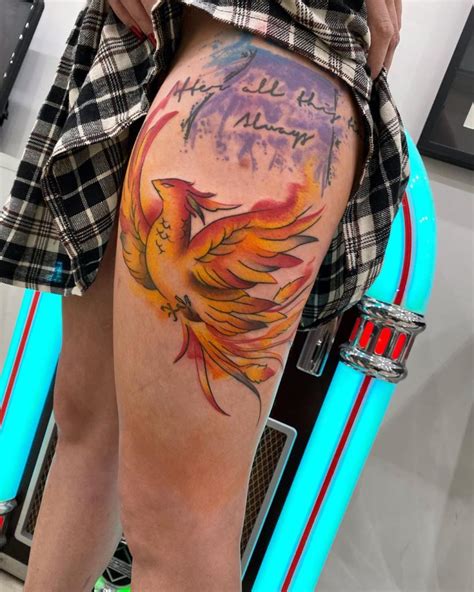 Our website provides the visitors with some great large watercolor phoenix tattoo. Phoenix Color Tattoo on Thigh with a Quote