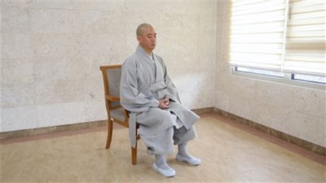 Woman sitting on a chair and drinking water from a glass. How to Meditate Sitting in a Chair, Part 1 | HuffPost