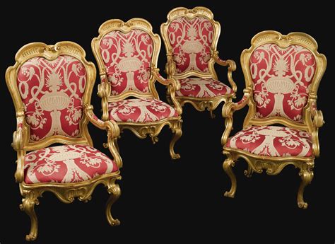 (#461) A set of four Italian Rococo carved giltwood armchairs Bologna