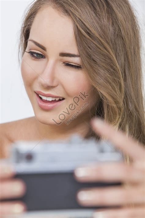 A Fair Haired Nude Woman Winking And Taking A Selfie On A Vintage Digital Camera Picture And Hd