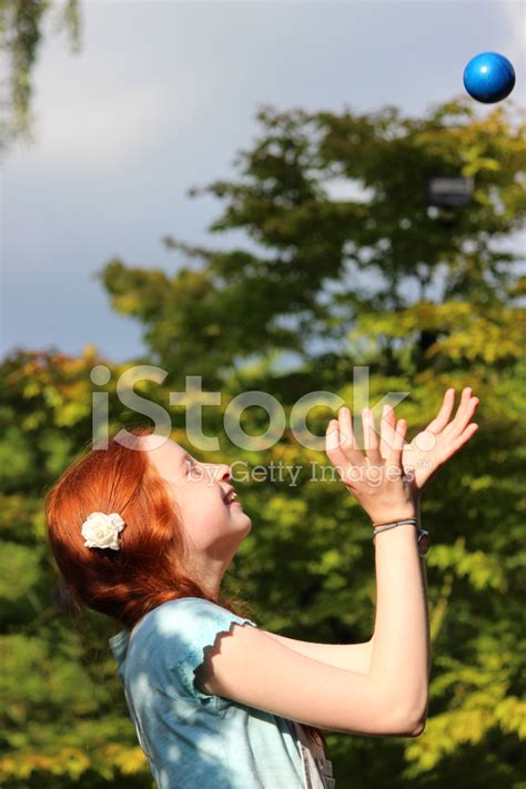 Image Of Girl Playing Catch In Garden Throwing Catching Ball Stock