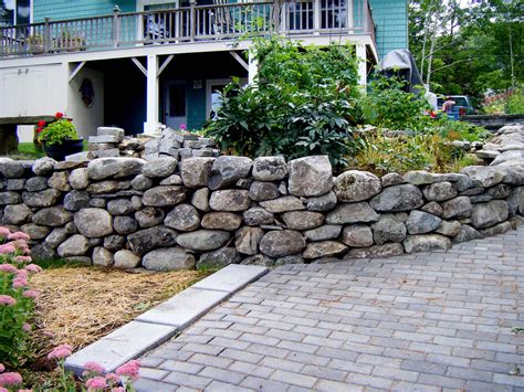 Select boulders with a flat 'top for comfortable lounging. Rock Walls for the Ages: Choosing the Right Stone | Rock ...