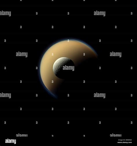 Saturns Largest And Second Largest Moons Titan And Rhea Appear To Be