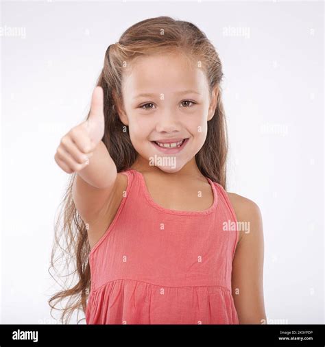 Shes So Happy And Carefree Studio Portrait Of A Cute Young Girl Giving