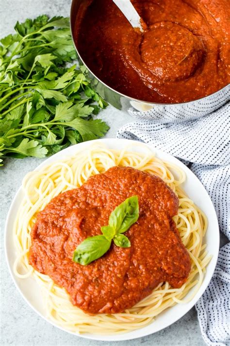 Spaghetti with tomato sauce, on a fork and ready to be eaten. how to make spaghetti sauce without tomato paste