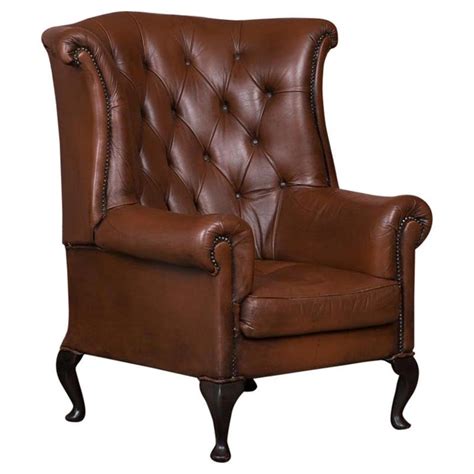 Only genuine antique leather chairs approved for sale on www.sellingantiques.co.uk. Early 20th Century Danish Brown Leather Wing Back Chair For Sale at 1stdibs