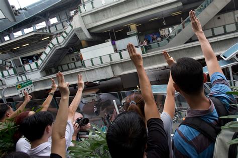 protestors in thailand adopt hunger games salute wired
