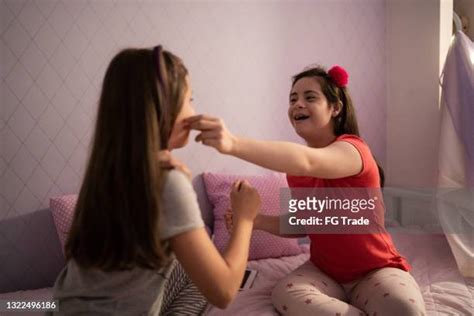 Young Girl Pinch Cheek Photos And Premium High Res Pictures Getty Images