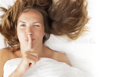 Womens Secrets Concept Portrait Of A Woman Lying In Bed Covered With A